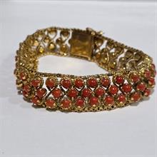Lotto 13 - Importante bracciale in oro giallo 18 carati e cor