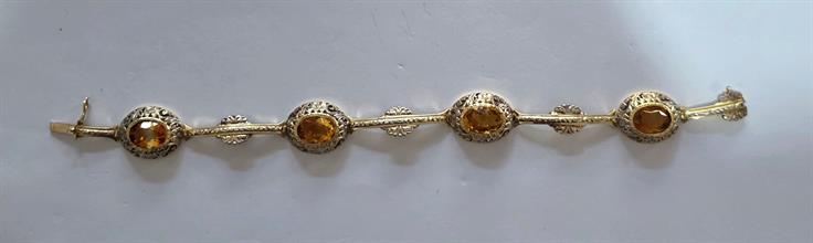 Lotto 56 - Bracciale in oro 9 carati e pietre